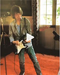 Mick plays guitar - gets ready for stage
